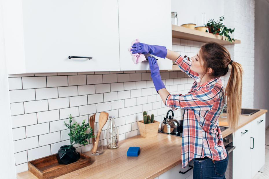 Young woman cleaning her house