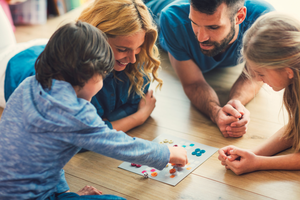 family playing a board game during covid pandemic